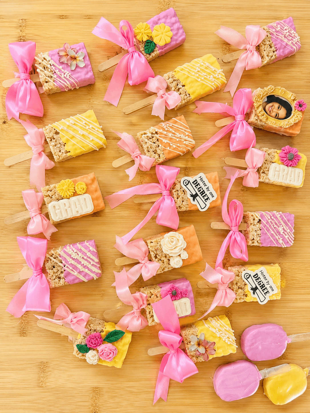 Rice Krispie treat pops with graduation edible images